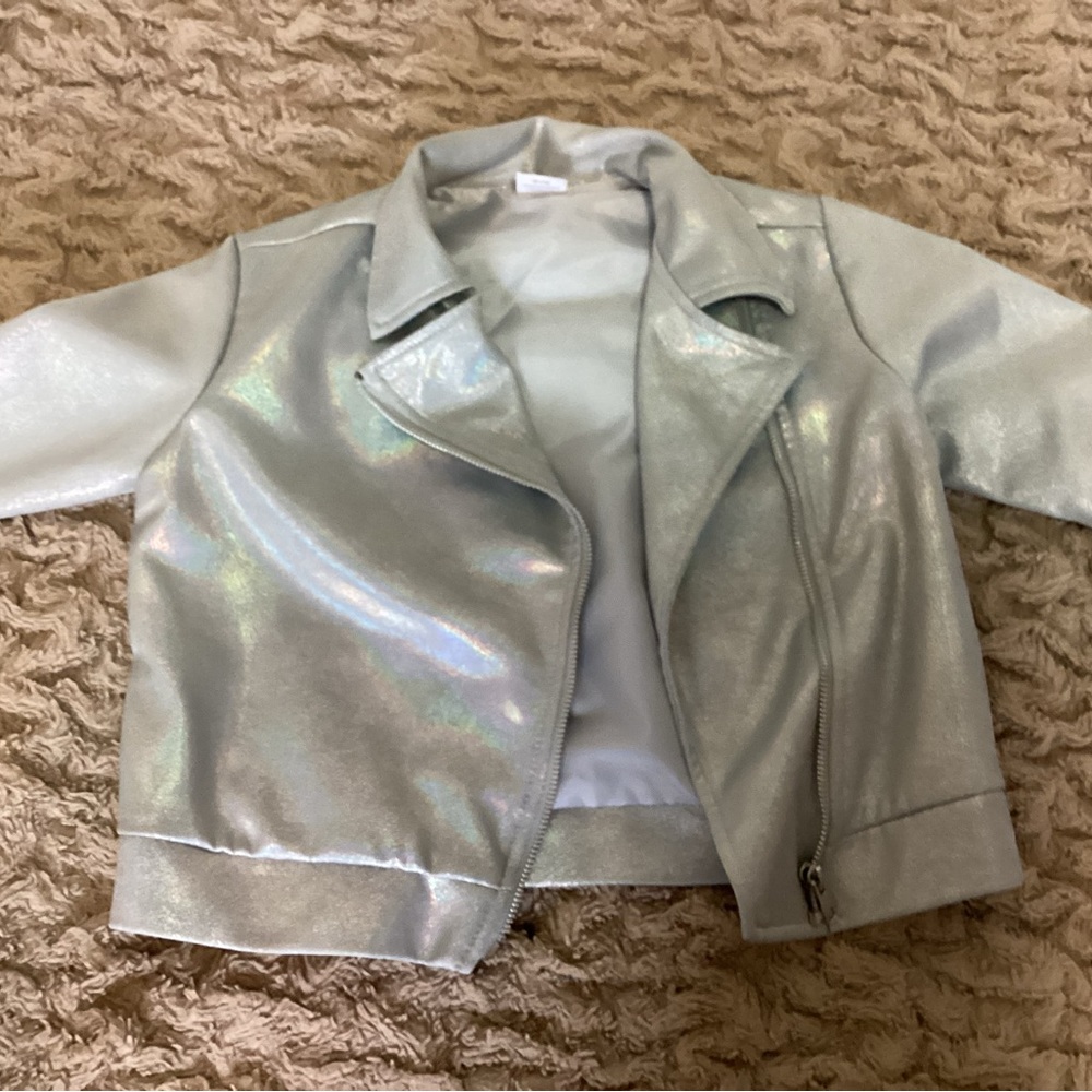Silver girls jacket with holographic color inside. Ouside zipper closure. Size M
